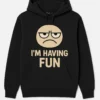 Funny Hoodie with Grumpy Cartoon Face and ‘I’M HAVING FUN’ Slogan