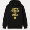 Positive Message Hoodie with 'DON’T FORGET TO SMILE' Text and Sun Design